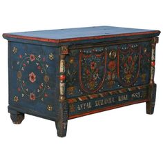 an ornate painted chest with flowers on it