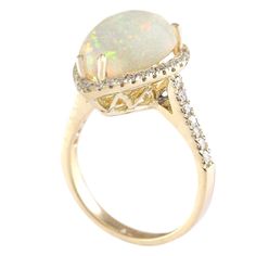 Stamped: 14K Yellow Gold Total Ring Weight: 5.9 Grams Ring Length: N/ARing Width: N/A Gemstone Weight: Total Natural Opal Weight is 4.67 Carat (Measures: 14.80x11.10 mm) Color: Multicolor Diamond Weight: Total Natural Diamond Weight is 0.60 Carat Quantity: 46 Color: F-G, Clarity: VS2-SI1 Face Measures: 18.95x14.10 mm Sku: [703967W] Luxury Yellow Gold Opal Ring With Accent Stones, Formal Gold Rings With Accent Stones, Oval Multi-stone Yellow Gold Rings, 14k Yellow Gold Opal Ring With Diamond Accents, Fine Jewelry Yellow Gold Opal Ring With Diamond Accents, Yellow Gold Opal Ring With Diamond Accents, Oval Yellow Gold Multi-stone Rings, Formal Multi-stone Opal Ring With Diamonds, Formal Multi-stone Diamond Opal Ring