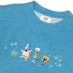 The gang’s all here on this Bikini Bottom blue embroidered crewneck! Take the Krusty Krew with you on your next adventure… they’re ready! 100% organic cotton Brushed on the inside for extra softness Gender neutral slim fit crew sweatshirt, designed to fall at the hip Cause-themed embroidery on left cuff Pre-washed to minimize shrinking Machine wash cool with like colors. Tumble dry low. Cool iron if needed. Made in India Blue Crew T-shirt With Embroidered Graphics, Fun Blue Crew Neck Sweatshirt, Fun Blue Cotton Sweatshirt, Blue Cotton Fun Style Sweatshirt, Fun Cotton Crew Neck Sweatshirt, Annual Sale, Comfortable Socks, Embroidered Crewneck, Us Man