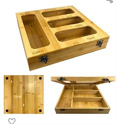 an open wooden box with compartments and handles