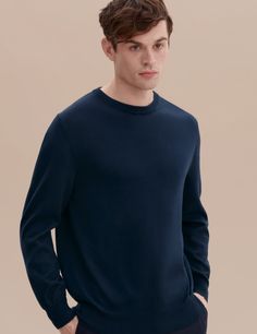 Our Cotton Knit Sweater is a necessary contemporary basic with impeccable quality; the timeless design will endure season after season. The mid-weight material makes the piece perfect for a range of climates - wear it as a layering piece over a shirt in Fall and under a coat in cooler months.

A mid-weight knit made from our premium Flamed Mercerized Peruvian Pima cotton yarn, which gives the piece its lustrous appearance. The Mercerization process also increased fiber strength and affinity to d Fitted Merino Wool Sweater For Business Casual, Casual Relaxed Fit Cashmere Sweater, Casual Cashmere Sweater With Relaxed Fit, Casual Cashmere Sweater With Ribbed Cuffs, Everyday Solid Cashmere Sweater, Business Casual Fine Knit Merino Wool Sweater, Everyday Merino Wool Sweater With Ribbed Collar, Everyday Cashmere Sweater, Fall Merino Wool Tops For Business Casual