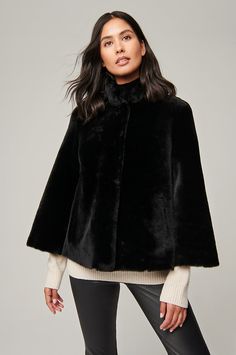 Delightfully dreamy, the Marilyn shearling cape jacket offers a stylish outerwear option for day-to-evening wear. Crafted of plush sheepskin, this layering-ready piece marries the practicality of a jacket with the playfulness and flexibility of a cape. With just enough pockets to safely hold your gloves and small essentials and a stand-up collar designed to shield you from wintery breezes, this jacket will swing and sway to your heart's content no matter where you take it. Leather Coat With Fur, Moto Jacket Style, Sheepskin Jacket, Cape Jacket, Lambskin Leather Jacket, Leather Jacket Style, Sheepskin Coat, Black Leather Gloves, Leather Trench Coat