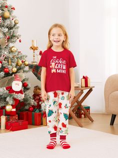 Get into the festive mood with our matching family Christmas pajamas! Embrace the holiday spirit with your favorite people and pets in our comfortable and cozy Gingerbread-themed sleepwear.
* Please add each size separately to your shopping cart.
* Each size includes 1 set of pajamas (1 top+1 bottom), or 1 romper, or 1 pet bandana.
* For children's safety, pajamas should be snug-fitting or flame-resistant. These kids' and babies' pajamas are flame-resistant.
* Gingerbread-themed print with THE Cookies CREW DADA/MAMA/MINI on the adults' and kids' pajamas.
* Drawstring and pockets on all pajama pants.
* Round neckline.
* Short sleeves.
* Suitable for home, leisure, and Christmas party.
* Regular fit.
* Medium length.
* Imported product sold by PatPat.
* Reliable supplier. Christmas Pajamas For Kids, Kids Christmas Pajamas, Pajamas For Kids, Opening Presents, Christmas Pajamas Kids, Matching Family Christmas Pajamas, Cute Christmas Outfits, Mens Pajamas Set, Cozy Pajamas