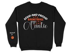 Celebrate your love for basketball and family with this Loud and Proud Basketball Auntie Sweatshirt. Perfect for game days or showing support, this comfortable crewneck can be personalized with your name on the sleeve to make it uniquely yours. Whether you're at the court or cheering from home, this sweatshirt is a great way to express your pride. Product Features: Fabrication: Medium-heavy fabric (8.0 oz/yd² (271.25 g/m 50% cotton, 50% polyester Seams: Without side seams Fit: Loose fit Sizing: Black Tops With Lettering For Sports Events, Basketball Letter Print Sportswear Tops, Basketball Sportswear Tops With Letter Print, Letter Print Sportswear Tops For Basketball, Sportswear Tops With Letter Print For Basketball, Black Sweatshirt With Name Print For Sports Events, Sporty Long Sleeve Basketball Top, Basketball Family, Pride Sweater