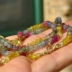 This rainbow necklace combines a vibrant array of Ruby, Sapphire, and Diopside gemstones. Its vibrant colors are perfect for lovers of bright colors and good vibes. Wear it as reminder or brighter things to come or as a symbol of your own inner radiance.  It's 18" long and knotted by hand on a custom-dyed lime green silk cord and finished with 14/20 gold filled findings and an 7mm spring ring clasp perfect for hanging charms, lockets, or talismans. . This necklace is a limited edition, and while Fine Jewelry Multicolor Gemstones With Accents, Fine Jewelry With Multicolor Briolette Gemstones, Multicolor Tourmaline Gemstones For Fine Jewelry, Multicolor Briolette Gemstones Fine Jewelry, Multicolor Tourmaline Gemstones Fine Jewelry, Multicolor Tourmaline Fine Jewelry, Multicolor Round Fusion Gemstones, Fusion Style Multicolor Round Gemstones, Multicolor Fine Jewelry Gemstones For Jewelry Making