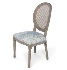 an old wooden chair with a blue and white upholstered backrest, on a white background