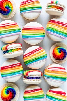 rainbow macarons with white frosting on them and the words overlay reads, how to make rainbow macaroons