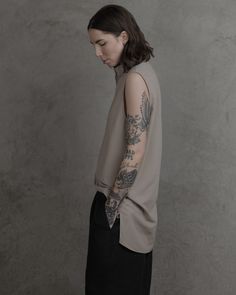 A summer top designed to stand-alone as a paradoxically refined sleeveless shirt, as an over-layer to elevate any t-shirt, or as an interlocking compliment the Chronos Mid-sleeve. Fabricated in a luxurious organic Japanese cotton that utilizes high-twisted yarns to achieve a shirt that's as light as it gets while staying strong enough to age well for decades. The shirt features a unique architectural side vent + seaming, extremely fine construction techniques, minimal collar, and a hidden placke Staying Strong, Construction Techniques, Japanese Cotton, Aging Well, Spring Shoes, Sleeveless Shirt, Summer Top, Light In The Dark, Women's Accessories