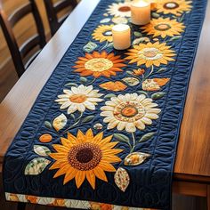 a table runner with sunflowers and candles on it