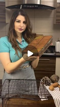 a woman holding a large piece of bread in her hands