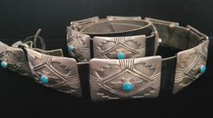 This concho belt by James Shay has 12 rectangular conchos and belt buckle. Each one is 1 and 1/4" by 1 and 7/8", with excellent stamp work and a round turquoise stone in each concho. In very good condition! Total weight is 351 grams. Length is 44". Stamped Sterling and "JS" on the buckle. Concho Belts, Ladies Outfits, Concho Belt, Suspender Belt, Belt Buckle, Turquoise Stone, Suspenders, Belt Buckles, Belts