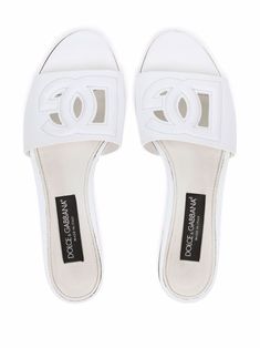 White calf leather DG Millennials logo slides from DOLCE & GABBANA featuring embossed logo to the front, cut-out detailing, almond toe, branded insole and flat rubber sole. | Dolce & Gabbana Millennials logo slides Dg Logo, Leather Cap, Dolce E Gabbana, Pumps Flat, Sandals For Sale, Leather Slides, Dolce & Gabbana, Embossed Logo, Leather Jewelry