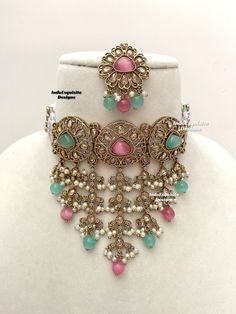 Elegant antique gold Polki pearls Choker Set with beautiful Jhumki earrings and Tikka/Indian Jewelry/ High quality kundan Polki jewelry/trendy choker/pink sky blue/pink surf  All items are shipped from Brampton, Ontario, Canada. If you need your item by a certain day, please reach out to us for express delivery option before placing the order so that we can update the shipping for you. Standard shipping/delivery timeline Below are the estimated delivery times after the order is shipped/dispatche Pink Kundan Jewelry With Intricate Design, Pink Kundan Necklace With Intricate Design, Pink Intricate Jewelry For Diwali, Festive Pink Jewelry With Intricate Design, Bollywood Style Jeweled Pink Jewelry, Polki Choker Set, Pearls Choker, Polki Choker, Brampton Ontario