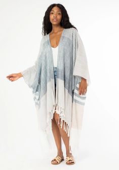 Summer Bohemian Beach Maxi Kimono with frayed detailing and striped pattern. White colored with Blue striped detailing. Striped Kaftan For Summer Beach Cover-up, White Cotton Cover-up For Warm Weather, Breezy Cotton Cover-up For Spring, Striped Kaftan For Spring Vacation, Striped Long Sleeve Summer Kaftan, Striped Long Sleeve Kaftan For Summer, Spring Striped Kaftan For Beach Cover-up, Bohemian Cotton Kimono, Spring Cotton Tunic Cover-up