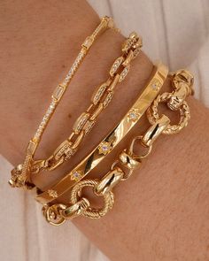 We love to throw on some chunky chains to elevate our everyday stack, and the Atlas bracelet is the perfect piece to add to your collection. We love the different textures and patterns on this bracelet - dress it up for a night out, or dress it down with your favorite sweater. 18k Gold Vermeil Designer Bracelet Stack Gold, Gold Fancy Jewellery, Feminine Jewelry Aesthetic, Gold Jewelry Aesthetic Bracelets, Bracelet Jewelry Design, Prom Jewelry Ideas Gold, Formal Gold Jewelry, Everyday Bracelet Stack, Vintage Gold Bracelets