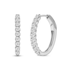 Achieve a most sophisticated look with these diamond oval-shaped hoop earrings. 10K white gold Each oval-shaped hoop features 1/20 ct. diamonds sparkling along the front edge 1 ct. t.w. of diamonds Hinged backs Oval Hoop Earrings In Diamond White With Brilliant Cut, Oval Diamond Hoop Earrings In White Gold, Oval Diamond White Hoop Earrings Fine Jewelry, Diamond White Oval Hoop Earrings With Prong Setting, White Gold Diamond Hoop Earrings With Oval Shape, Oval Diamond Hoop Earrings With Diamond Accents, White Gold Oval Diamond Hoop Earrings, Diamond White Oval Hoop Earrings For Formal Occasions, Oval Diamond Hoop Earrings With Accents