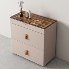 an empty drawer with some items on it and a white wall in the back ground