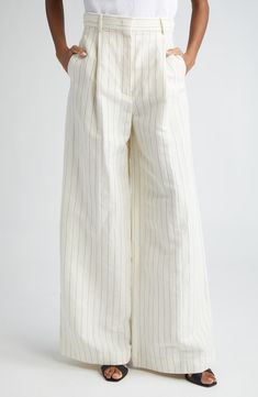 Slender pinstripes pattern runway-showcased trousers fashioned from an airy blend of linen and cotton in a breezy, wide-leg silhouette. Zip fly with hook-and-bar closure Side-seam pockets; back welt pockets 58% linen, 42% cotton Dry clean Made in Italy Designer Clothing Wide Leg White Pants, Cullotes Pants, Horizontal Lines, Trouser Style, Fashion Icon, Dark Fashion, White Pants, Linen Women, Striped Pants