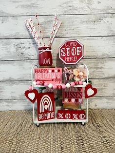 a valentine's day display with red and white decorations