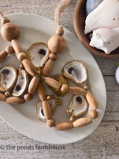 mushrooms are arranged on a white plate next to garlic