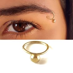 Unique Tribal Eyebrow Ball Piercing Ring, a Boho-Hippie Eyebrow Ring made of 14k Solid Gold, Unisex Indian Piercing Jewelry, Statement Jewelry for Women and Men Ramp up your fashion statement factor and get yourself unique eyebrow-piercing jewelry! This unique eyebrow-piercing ring is sure to make a statement made of the finest 14k solid gold. Intended to highlight pretty features in your appearance or to add a cool edge to your style, it also fits different Piercing Locations: nose ring, Septum Eyebrow Piercing Ring, Indian Piercing, Piercing Locations, Eyebrow Piercing Jewelry, Pretty Features, Eyebrow Ring, Eyebrow Piercing, Piercing Ring, Jewelry Statement