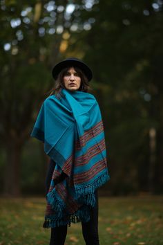 Discover the charm of our beautiful scarf with ethnic patterns and symbols! This cozy and versatile accessory can be worn as a stole, scarf, blanket, or decoration.  Crafted from luxuriously soft wool (50%) and viscose (50 it provides warmth and features vibrant colors and fascinating patterns that elevate any outfit. Unisex and adorned with fringes, this scarf is the perfect companion in chilly weather.  Measuring 100 cm in width and 210 cm in length (excluding fringes), it offers diverse styling possibilities. Available in 5 colors/patterns (Red, Dark Red, Turquoise, Dark Blue, Beige) and sourced on a Fair Trade basis, this accessory is not only stylish but also ethically conscious.  Surprise your loved ones with the perfect Christmas gift! ※ ---›Dimensions‹---  Width: 100 cm Length: 210 Folk Style Handwoven Shawl, Handwoven Folk Shawl One Size, Bohemian Pashmina Shawl For Fall, Bohemian Shawl Wrap For Fall, Fall Bohemian Pashmina Shawl In One Size, Handwoven Festival Shawl, One Size, Festival Handwoven Shawl One Size, Handmade Folk Shawl For Festival, Bohemian Pashmina Shawl Wrap