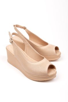 Step into elegance and comfort with these chic Beige Wedge Sandals, meticulously crafted for the fashion-forward woman. The perforated upper design adds a touch of sophistication, while the breathable material keeps your feet cool and comfy throughout the day. 🌬️✨ Heel Height: Revel in the added inches of our stable wedge heel, designed to elongate your legs without sacrificing comfort. 👠 Peek-a-boo Toes: Flirty peep-toe silhouette to show off your pedicure, perfect for sunny days out.🌞👣 Secure Fit: An adjustable slingback strap with a sleek buckle ensures your sandals stay comfortably in place, no matter where your steps take you. 🔒👡 Durable Sole: Walk with confidence on any terrain with our robust, non-slip sole that promises enduring wear. ️💪 From leisurely brunches to evening st Elegant Beige Open Toe Wedge Sandals, Beige Platform Slingback Wedge Sandals, Beige Slingback Wedge Sandals With Platform, Chic Beige Slingback Wedge Sandals, Summer Wedge Heel Slingback Pumps With Removable Insole, Elegant Slingback Sandals With Wedge Heel, Beige Formal Wedge Sandals, Formal Beige Open Toe Wedge Sandals, Beige Wedge Sandals