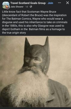 an old photo of a man with a beard wearing a batman mask and looking at the camera