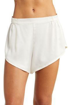 These short silk pajamas are naturally hypoallergenic, breathable and ideal for those with sensitive skin; best part—they can go in the washing machine. The slouchy, oversized T-shirt pairs perfectly with the angled-cut shorts that feature grippers on the waistband for a stay-put fit. 27" regular front top length; 31 1/2" back top length; 2" inseam; 33" leg opening; 13 1/2" front rise; 16 1/2" back rise (size Medium) Top has scoop neck; short sleeves; chest patch pocket; high-low hem Shorts have White Sleepwear With Built-in Shorts, Chic Short Sleepwear For Loungewear, Silk Sleepwear For Spring Lounging, Summer Silk Sleepwear, Summer Daywear Sleepwear With Built-in Shorts, Summer Sleepwear With Short Legs, Summer Sleepwear With Elastic Waistband For Relaxation, Loungewear Sleepwear With Built-in Shorts, Chic Stretch Summer Sleepwear