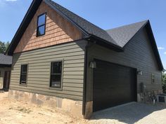 two garages are shown in front of a house