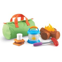 an assortment of toys including a toy car, picnic set and camping gear on a white background