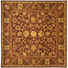 a red and gold rug with an ornate design on the center, surrounded by flowers