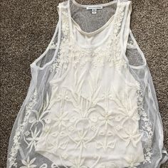 Selling This Lace American Eagle Tank Top. Underneath It Has A Plain White Tank And Then It Has Lace Covering The Whole Shirt. Super Cute For Vacation Or Summer! Brand New Condition. This Is A Size Extra Small. Casual Sheer Sleeveless Tops, Casual White Sheer Top, Spring Vacation Tops With Sheer Details, Spring Vacation Sheer Tops, Casual Sheer Top For Vacation, White Sheer Top For Day Out, Casual White Lace Tank Top, Sheer Sleeveless Top For Spring, White Sheer Summer Top