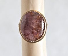 "Sized to Order!! Lovely Amethyst Cacoxenite, Melody Stone or Super Seven stone.  The oval cabochon shows nice purple shading with gold rutiles.  The stone is set in a fine silver bezel on a fine silver base plate.  The ring band is Sterling silver, approximately 3mm wide, with a floral design.  The cab measurements are 21x17mm.  Amethyst Cacoxenite, SUPER SEVEN\" or \"Sacred 7\", sometimes called Melody's Stone, comes from the Espiritu Santo region of Brazil, and contains within it seven differ Stone Pictures, Cabochon Ring, Ring Stone, Stone Setting, Smokey Quartz, Ring Band, Oval Cabochon, Stone Settings, Purple Gold