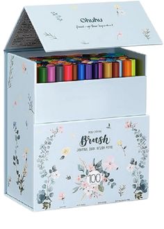 the brush box is filled with colorful crayons and flowers on it's sides