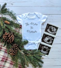 a baby's bodysuit with the words, the more the mother on it