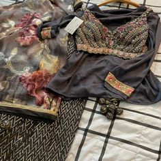 Hi Ladies I’m Selling A Beautiful Indian 4 Piece Outfit. I Will Consider All Offers, Tags Attached Still. And Everything Comes From A Pet-Free And Smoke-Free Home Measurements Of Blouse: 36” Busy With 2 Inches Of Margin Inside For Alterations. Also, The Pads Can Be Removed And Sleeves Can Be Added. Skirt/Lengha Has A Zipper Opening On The Side And Waist Is 34 Inches Circumference And It Is 42 Inches Long. Designer Embellished Black Palazzo Set, Traditional Embellished Black Palazzo Set, Embellished Black Bollywood Palazzo Set, Elegant Black Embellished Palazzo Set, Designer Georgette Sets For Festive Occasions, Designer Festive Sets In Georgette, Festive Designer Georgette Sets, Black Embellished Palazzo Set For Diwali, Elegant Multicolor Silk Palazzo Set