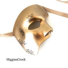 This half-face mask is designed for those who seek to embrace the mystique and grandeur of the stage. Adorned with shimmering gold filigree, it pays homage to the iconic Phantom of the Opera while adding a touch of allure to your ensemble. Be the embodiment of opera's timeless elegance and captivate hearts with your dramatic presence at masquerade balls, themed parties, and other events!


Age Group/Gender - Adult/Men

Size/Type - One size fits all adults

Mask Color - Gold

Mask Material - Poly Half Face Masquerade Mask, Mens Mask, Ball Masks, Phantom Mask, Masquerade Ball Masks, Masks Black, Gold Masquerade Mask, Mens Masquerade Mask, Silver Mask