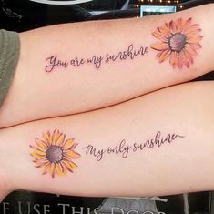 two sunflowers with the words you are my sunshine and my dolly sunshine tattooed on their legs