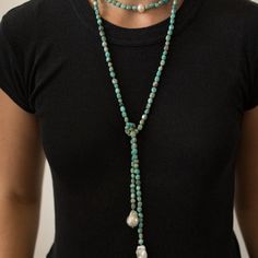 Pairing the captivating sea-green stone of the ancients with exotic baroque pearls, Laurie represents wisdom, tranquility, good fortune and hope. Beautiful turquoise accents make this freshwater pearl lariat necklace an unforgettable look for any occasion.Each piece of jewelry created by The Freshwater Pearl Company features genuine freshwater cultured pearls. Our collections are proudly designed in Palm Springs and distributed in the U.S. from our San Diego studio for a touch of California coas Elegant Turquoise Beaded Lariat Necklace, Bohemian Lariat Pearl Jewelry, Bohemian Turquoise Pearl Necklace With Gemstone Beads, Adjustable Turquoise Elegant Lariat Necklace, Adjustable Bohemian Turquoise Pearl Necklace, Elegant Adjustable Turquoise Lariat Necklace, Elegant Adjustable Lariat Turquoise Necklace, Adjustable Bohemian Baroque Pearl Jewelry, Bohemian Long Pearl Necklace With Natural Stones