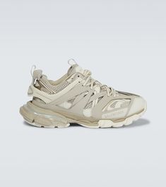 First introduced in 2018, the multi-layered, faux leather and mesh uppers of these Balenciaga Track sneakers are made with a double lace-up design, set on chunky rubber soles. | Balenciaga Track sneakers Balenciaga Trainers, Balenciaga Track Sneakers, Track Sneakers, Balenciaga Men, Balenciaga Sneakers, Chain Strap Bag, Oversized Tote Bag, Balenciaga Track, Floral Shoes