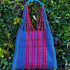 This unique bag is beautifully made on a waist loom, (Telar de Cintura) by artisans from Chiapas México. Each bag is individually handwoven with a unique colors and designs . There is not other like it! Use this reusable and eco-friendly, 100% cotton loom tote bag as a shopping bag for farmer's markets . Dress it down with a t-shirt and jeans or shorts! or to add a boho vibe to any outfit. Details: Tote measurements: 14 x 16.5 inch Handle drop: 10" Material: 100% Cotton Color: blue with colorful Eco-friendly Handwoven Blue Beach Bag, Eco-friendly Blue Handwoven Beach Bag, Blue Handwoven Beach Bag For Market, Blue Handwoven Beach Bag, Eco-friendly Handwoven Blue Shoulder Bag, Eco-friendly Blue Handwoven Shoulder Bag, Blue Handwoven Festival Bag, Eco-friendly Handwoven Blue Bags, Artisan Blue Handwoven Bags