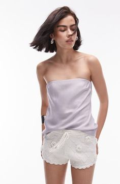 Whether you're headed for a night out or meeting friends for brunch, you'll love rocking this sleek strapless top made from slinky satin and cut in a longline silhouette. Strapless 100% viscose Machine wash, line dry Imported Glamorous Summer Tube Top With Spaghetti Straps, Strapless Camisole For Night Out, Summer Tops For Night Out With Straight Neckline, Glamorous Tube Top With Spaghetti Straps For Summer, Summer Tops With Straight Neckline For Night Out, Bandeau Tube Top For Night Out In Spring, Spring Bandeau Tube Top For Night Out, Bandeau Tube Top For Spring Night Out, Silk Bandeau Tube Top For Party