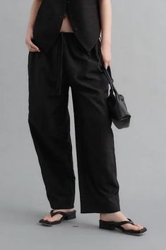 Artful Linen Drawstring Wide Leg Cargo Pants for a Relaxed Chic Look Discover the perfect blend of comfort and style with our Linen Drawstring Wide Leg Cargo Pants. Featuring a drawstring waist, these low-rise cargo pants offer a relaxed and customizable fit. The wide-leg silhouette and utility-focused design are not only fashionable but also offer plenty of room for movement. Crafted from natural linen, these pants ensure a cool and breathable experience, perfect for a laid-back summer look. St High-waisted Pants With Tie Waist And Relaxed Fit, Relaxed Fit High-waisted Pants With Tie Waist, High-waisted Relaxed Fit Pants With Tie Waist, Casual Bottoms With Drawstring Tie, Stretch Straight Leg Pants With Drawstring, Versatile Wide-leg Pants With Tie Waist, Loungewear Straight Pants With Tie Waist, Straight Loungewear Pants With Tie Waist, Black Wide-leg Pants With Tie Waist