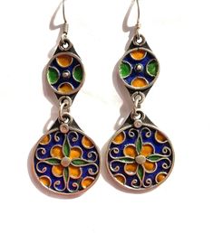 this is a beautiful pair of vintage style silver Berber enamelled earring from Morocco.  It is all handmade by the best Berber silver smith in Morocco.  The silver is over 90% Size: 2.7 inch long and one inch wide Pierced Dangle Earrings In Enamel, Bohemian Enamel Drop Earrings, Artistic Enamel Drop Earrings, Green Enamel Earrings With Artistic Design, Nickel-free Enamel Drop Earrings, Artistic Design Enamel Drop Earrings, Bohemian Multicolor Enamel Earrings, Vintage Multicolor Enamel Jewelry, Vintage Round Enamel Earrings