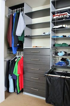 an organized closet with clothes and shoes