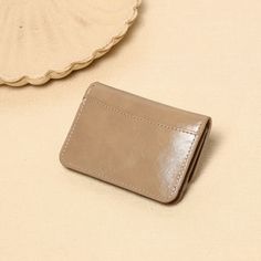 Our wallet boasts a sleek and refined look, perfect for both casual and formal settings. The vintage lock adds a unique, stylish touch that stands out. Fabric: PUsize:12*2*8cmWeight:0.05kg Classic Compact Coin Purse With Card Slots, Classic Compact Coin Purse With Interior Card Slots, Classic Beige Leather Wallet, Compact Card Holder With Card Slots, Compact Card Holder With Card Slots For Everyday Use, Chic Rectangular Coin Purse With Card Slots, Classic Coin Purse With Card Slots For Daily Use, Elegant Leather Coin Purse With Card Slots, Elegant Leather Card Holder With Rfid Blocking