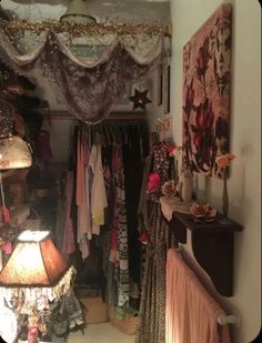 a room filled with lots of clothes and lamps