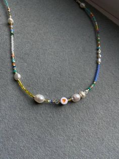 Rainbow beaded necklace is handmade from the best materials. You can buy it as a gift for a friend, sister, mother. BEADS SIZE : The pearls are 3-9mm (0.11 - 0.35 inch), and the beads are 2-4mm (0.07 - 0.13 inch). The LENGHT: The length is adjustable. You can choose your size. If you need a custom size feel free to write, I'll make a custom size choker for you. IMPORTANT: A chain is added to each choker for additional control. IMPORTANT INFORMATION: *Created in a pet-free and smoke-free home. * Trendy Handmade Birthday Necklaces, Everyday Handmade Pearl Beaded Necklaces, White Letter Beads Necklace For Friendship, White Trendy Necklace For Friendship, Trendy White Necklaces For Friendship, Trendy Pearl Necklaces With Heart Beads, Handmade White Necklace For Mother's Day, Colorful Beads Heart Shaped Beaded Necklace Gift, Heart Shaped Colorful Beaded Necklaces For Gifts