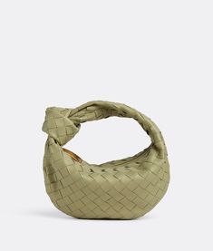 "Find BOTTEGA VENETA Mini Jodie on Editorialist. Mini Intrecciato leather top handle bag. Single compartment. Zipper closure. Lining: Calfskin. Color: Travertine. Hardware: Gold finish. Height: 23 cm | 9.1\". Width: 28 cm | 11\". Depth: 8 cm | 3.15\". Handle drop: 10 cm | 3.9\". Lambskin." Bottega Jodie, Bottega Veneta Jodie, Mini Jodie, Lv Bags, Mode Inspiration, Green Bag, Leather Top, Bag Pattern, Bottega Veneta